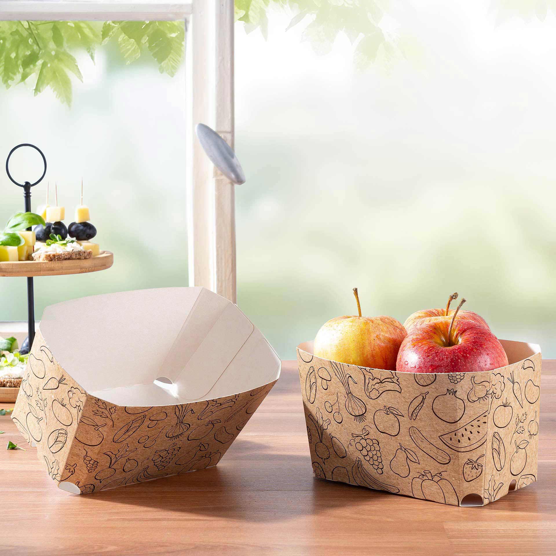 Zwei Universalschalen aus Vollpappe, eine gefüllt mit Äpfeln.